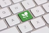 pic of technology  - Leaf graphic on green computer keyboard key  - JPG 