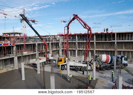 Picture or Photo of Construction site with cement mixer and blue sky