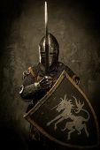 stock photo of grey  - Medieval knight on grey background - JPG 