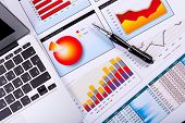 stock photo of money  - Financial paper charts and graphs on the table - JPG 