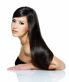 pic of hair  - Portrait of beautiful young woman with long straight brown hair posing isolated on white background - JPG 