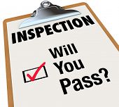 stock photo of pass  - The word Inspection on a checklist attached to a clipboard - JPG 