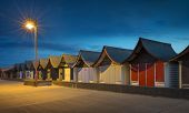 pic of hut  - A row of historic pagoda style beach huts at night at Mablethorpe - JPG 