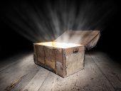 pic of money  - Ancient wooden treasure chest with the strong glow from inside - JPG 