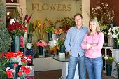 picture of man  - Man and women standing outside florists - JPG 