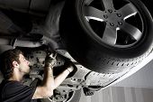stock photo of transportation  - Auto mechanic working at auto repair shop - JPG 