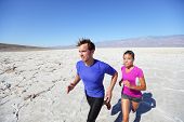 stock photo of fitness  - Trail running marathon athletes outdoors in desert - JPG 