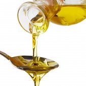 pic of pour  - Olive oil poured into a spoon isolated on white background - JPG 