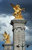 pic of france  - Columns with gilded sculptures symbolise war and agriculture on the bridge Alexandre III in Paris France - JPG 