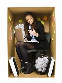 picture of business people  - Businesswoman in a very small Cardboard Office isolated on white background - JPG 