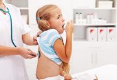 picture of health  - Little girl coughing at the doctor checkup  - JPG 