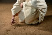 stock photo of religion  - Jesus writing in the sand with finger - JPG 