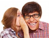 pic of laughing  - Pretty girl talking secret to young man in his ear - JPG 