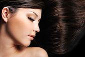 stock photo of hair  - beautiful young female face with long beauty hair as background - JPG 