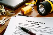 pic of home  - Real estate home inspection report of resale residential property condition with professional housing engineering inspector testing tools and house keys  - JPG 