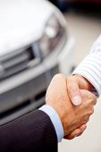 foto of handshake  - Business handshaking to close the deal after buying a car - JPG 