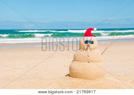 Picture or Photo of Snowman on holidays made out of sand instead of snow. Concept could be used for Global Warming & Christmas Cards