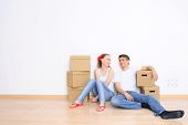 image of rest  - Young couple resting from moving into a new home - JPG 