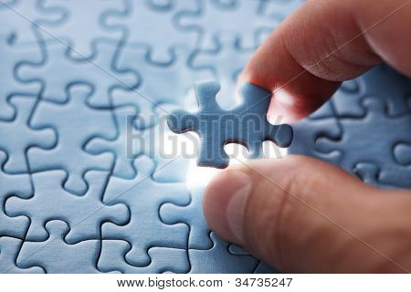 Picture or Photo of The last piece of jigsaw puzzle concept for solutions and completion