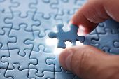 foto of insert  - The last piece of jigsaw puzzle concept for solutions and completion - JPG 