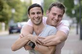 stock photo of outdoor  - Portrait of a happy gay couple outdoors - JPG 