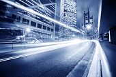 stock photo of bridge  - Fast moving cars lights blurred over modern city background - JPG 