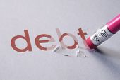 foto of debt  - pencil erasing the word - JPG 