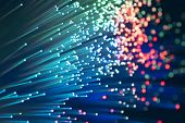 foto of technology  - bunch of optical fibres dinamic flying from deep on technology background - JPG 