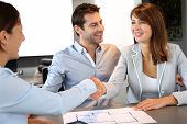 picture of handshake  - Couple concluding construction and financial contract - JPG 