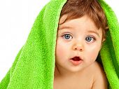 stock photo of children  - Image of cute baby boy covered with green towel isolated on white background - JPG 