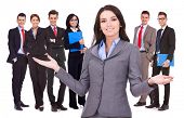 stock photo of leadership  - business woman leader welcoming to her successful team - JPG 