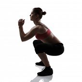 foto of sports  - sport girl doing squatting exercise - JPG 