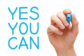 stock photo of blue  - Yes You Can and hand holding blue marker - JPG 