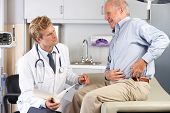 pic of medical doctors  - Doctor Examining Male Patient With Hip Pain - JPG 
