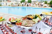stock photo of restaurant  - catering buffet food outdoor in luxury restaurant with meat and colorful fruits - JPG 