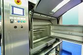 stock photo of industrial  - Large opened industrial drying machine for laundry at special presentation - JPG 