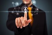 picture of business people  - Businessman pressing modern social buttons on a virtual background - JPG 