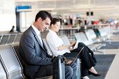 pic of businessmen  - businessman and businesswoman using laptop and tablet computer at airport - JPG 