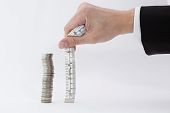 pic of investment  - a stack of coin is measured as 10 centimetre representing growth wealth and return of investment - JPG 
