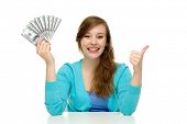 stock photo of finance  - Young woman holding dollar bills - JPG 