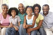 pic of family  - Extended Family Relaxing On Sofa At Home Together - JPG 