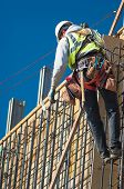 stock photo of construction worker  - A construction worker on a high wall - JPG 