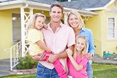 picture of standing  - Family Standing Outside Suburban Home - JPG 