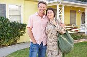 foto of home  - Husband Welcoming Wife Home On Army Leave - JPG 