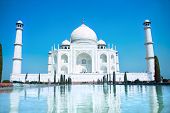stock photo of religion  - World wonder Taj Mahal in soft daily light with clear blue sky - JPG 