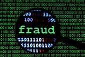 picture of fraud  - Close up of magnifying glass on Fraud - JPG 