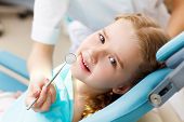 picture of infants  - Little girl sitting in the dentists office - JPG 