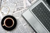 pic of newspaper  - workplace with laptop and coffee cup on newspaper background - JPG 